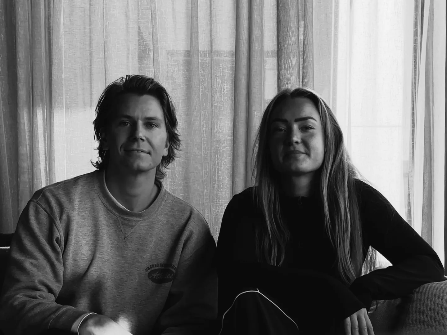 Julius and Line, the two of us behind Plant, side by side on a sofa in the studio.